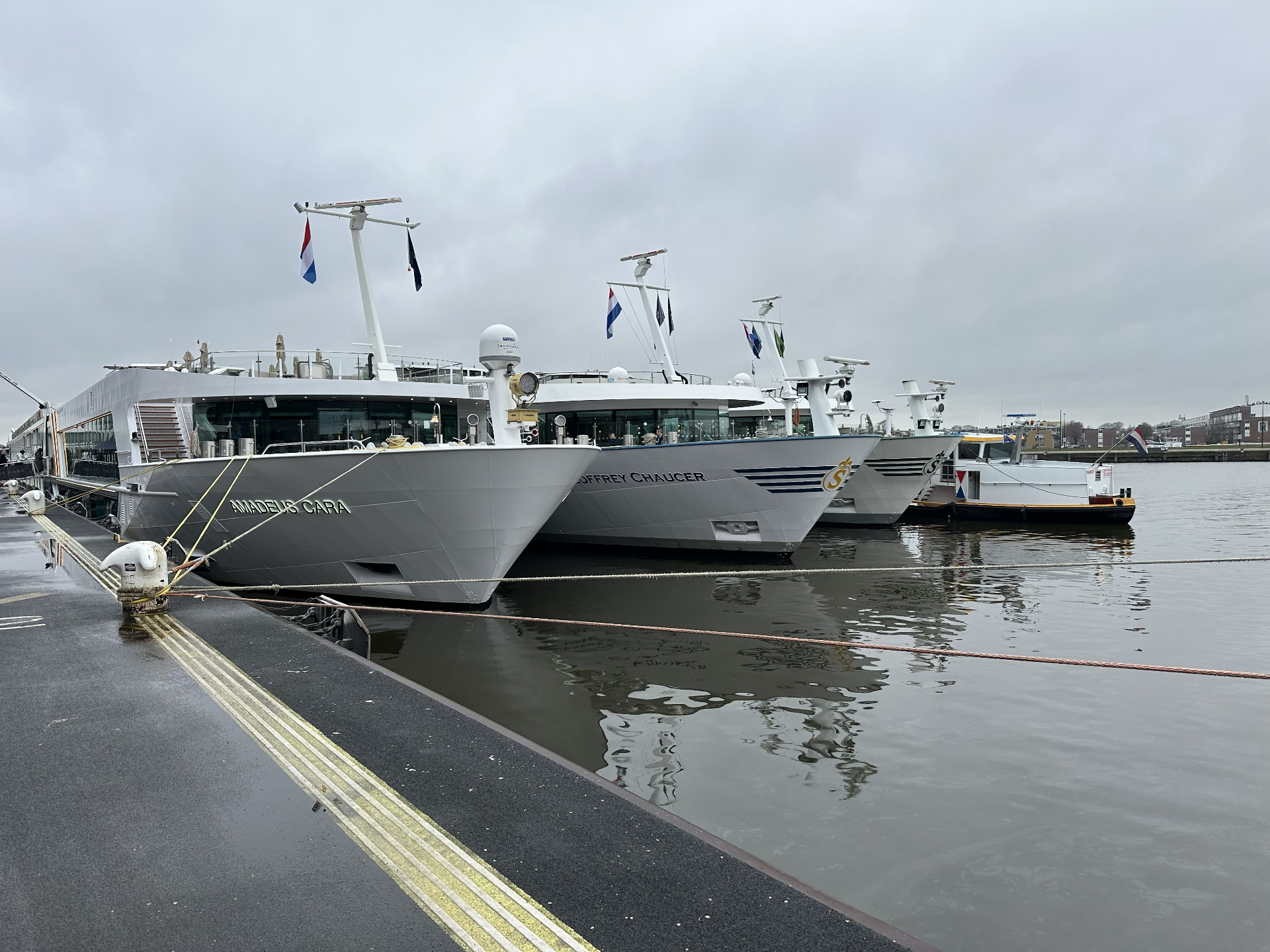 Luxury river cruise ships Amadeus Cara and Geoffrey Chaucer docked side by side in Amsterdam, illustrating how to choose the right river cruise line. Luxury river cruise ships Amadeus Cara and Geoffrey Chaucer docked side by side in Amsterdam, illustrating how to choose the right river cruise line.